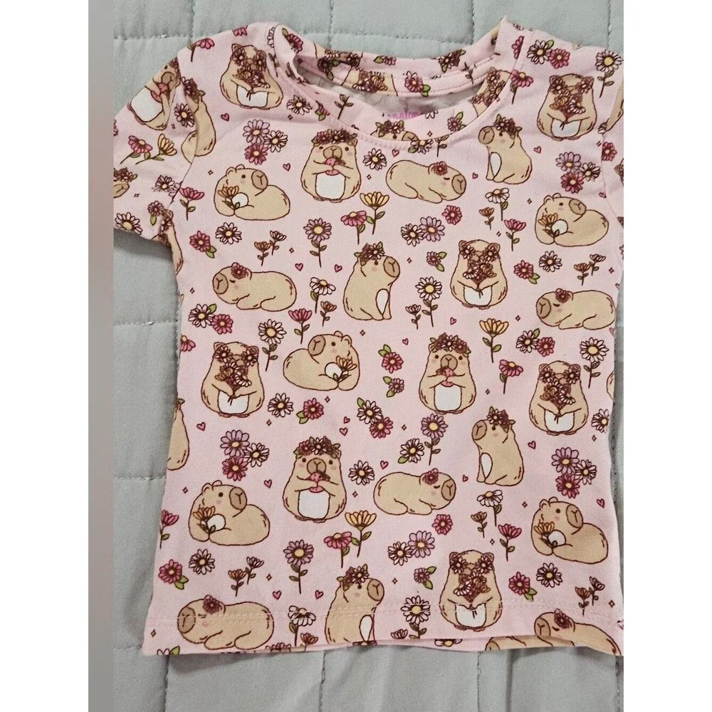 Penelope Mack,  pink capybaras and floral Pjs